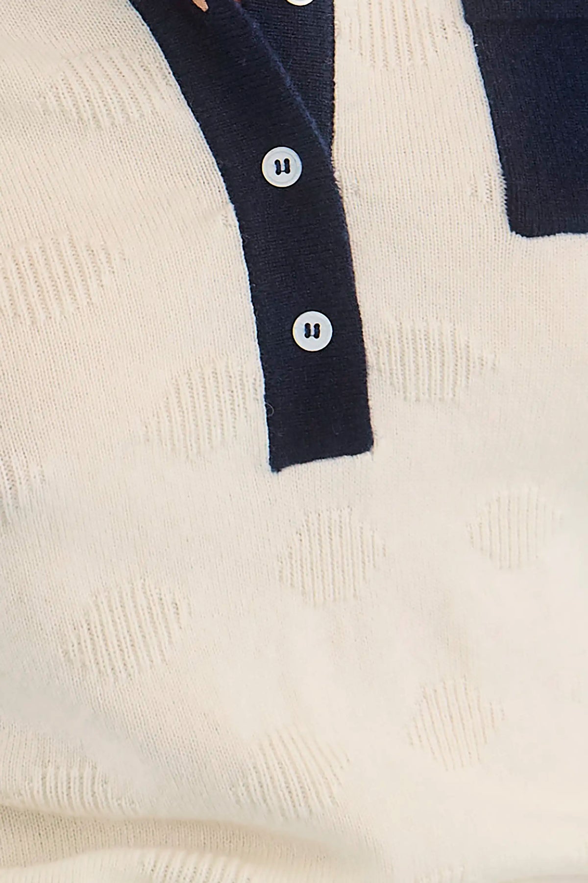 Close up of the Archie Polo in Ivory. 