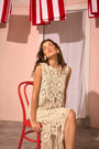 The Astor Top in cream paired with matching skirt.