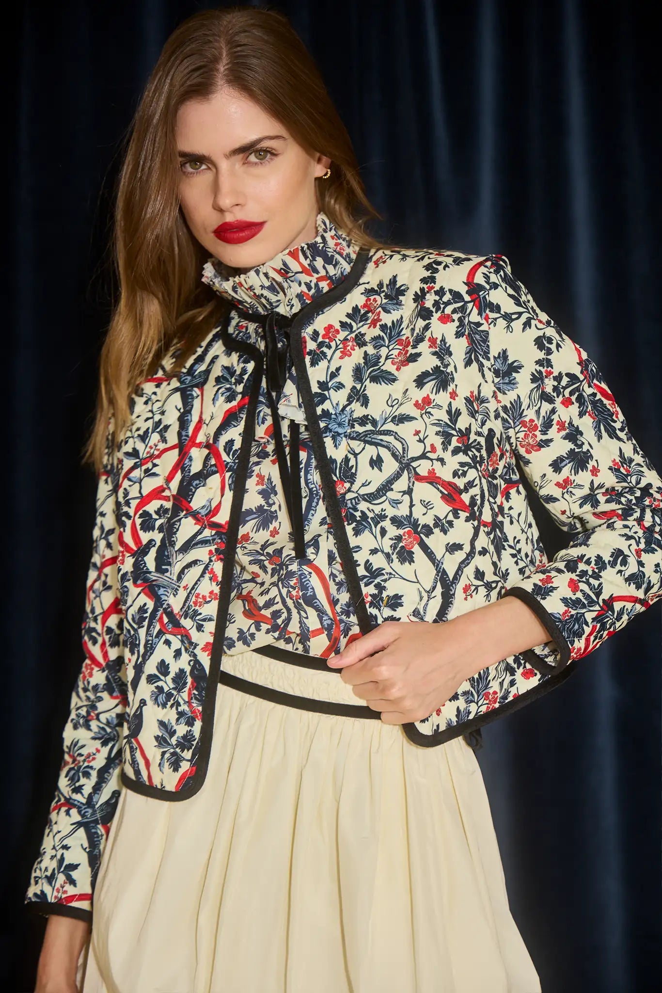 The Angelina Skirt is the bubble mini in ivory taffeta with velvet ribbon detailing.