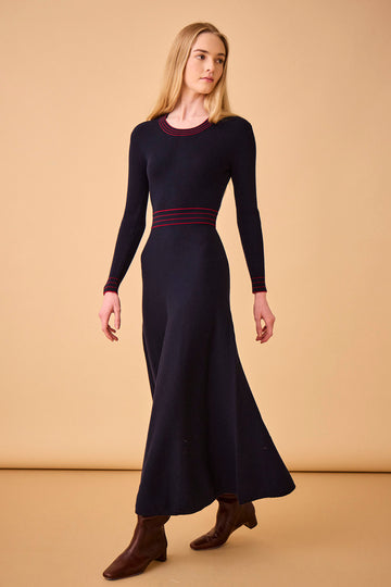 The Beatrice is a ribbed wool blend, long sleeve knit dress with a fitted bodice and flare skirt.