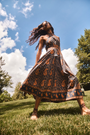 The Bellamy Dress in Glen Paisley flowing in the wind outside. 