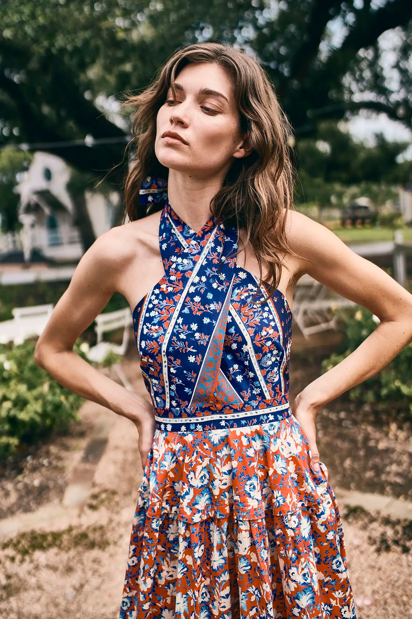 The Bellamy Dress is a criss cross halter dress with a full skirt and a clean side seam zipper.