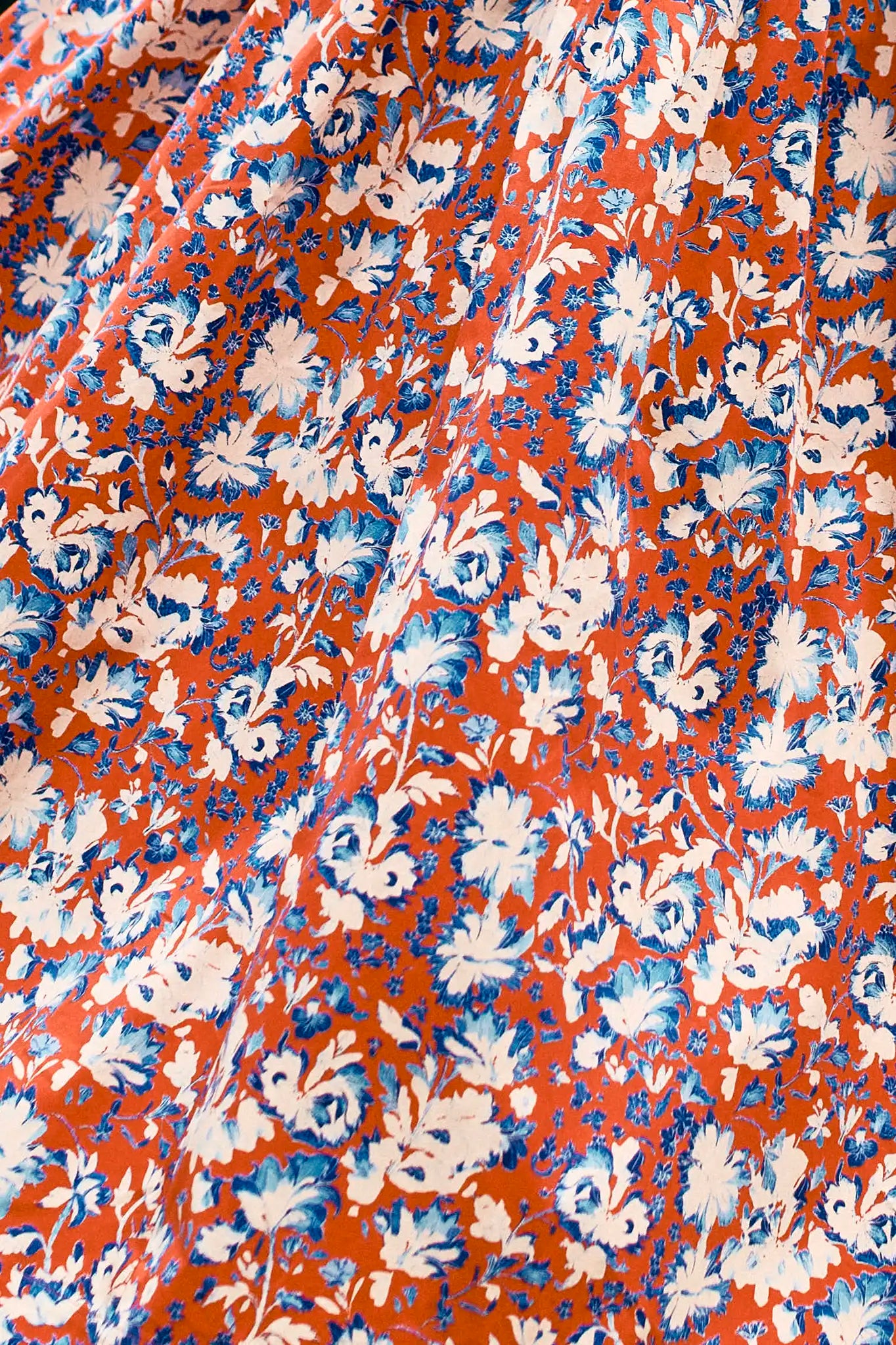 The Bellamy Dress is a criss cross halter dress with a full skirt and a clean side seam zipper.