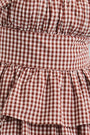 Close up of the The Betsy Dress in Cotswold Check Rust micro gingham.