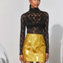 The Blaise Top in Noir Lace paired with the Britt Mini Skirt in Gilded Jacquard. 