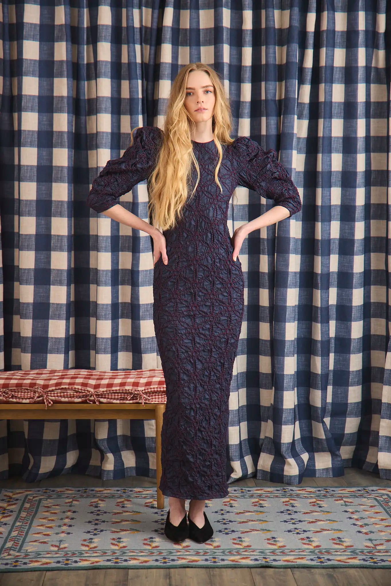 The Blythe Dress is midi body con dress with a crew neckline and oversized ruched long sleeves.