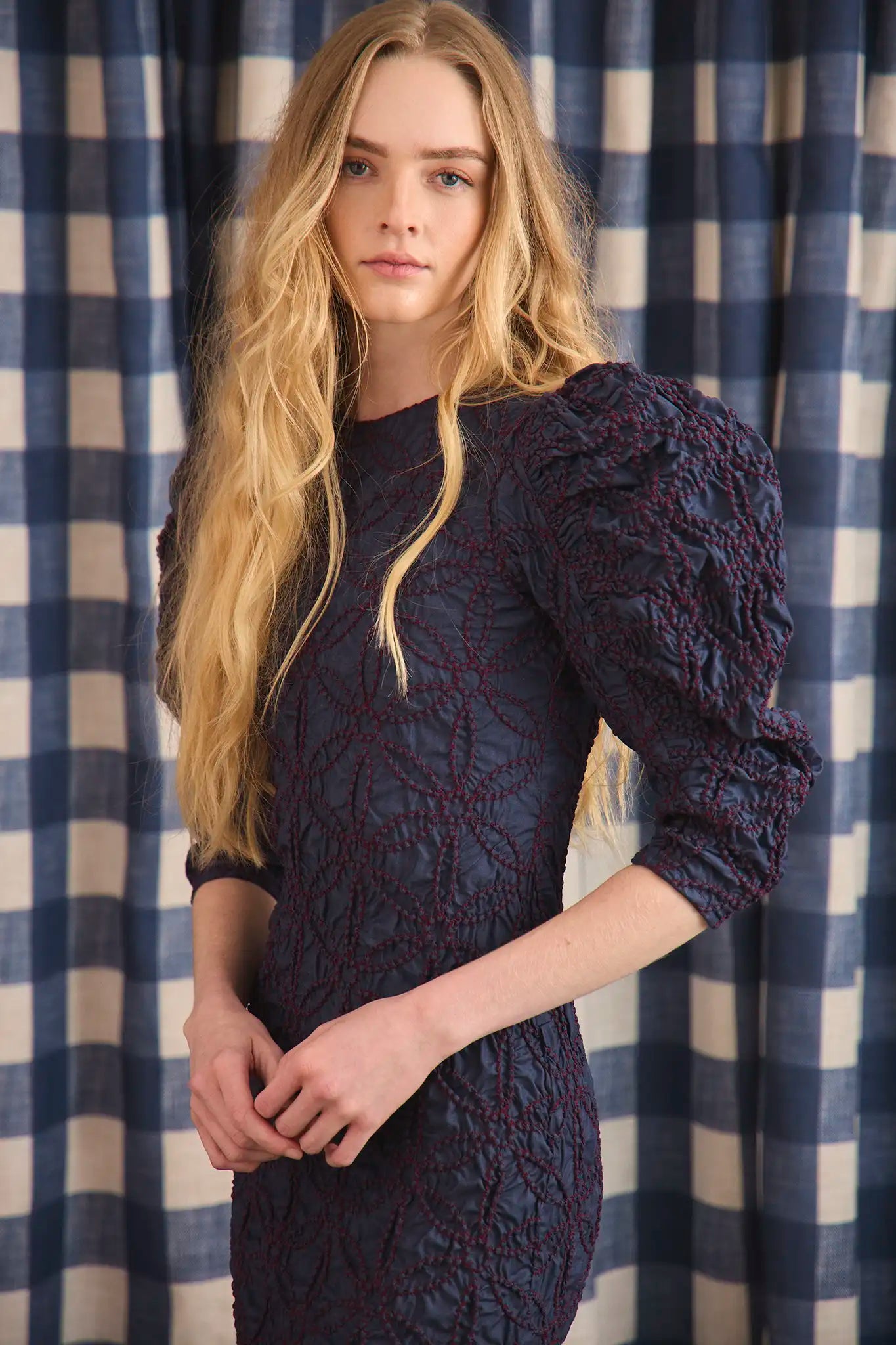 The Blythe Dress is midi body con dress with a crew neckline and oversized ruched long sleeves.