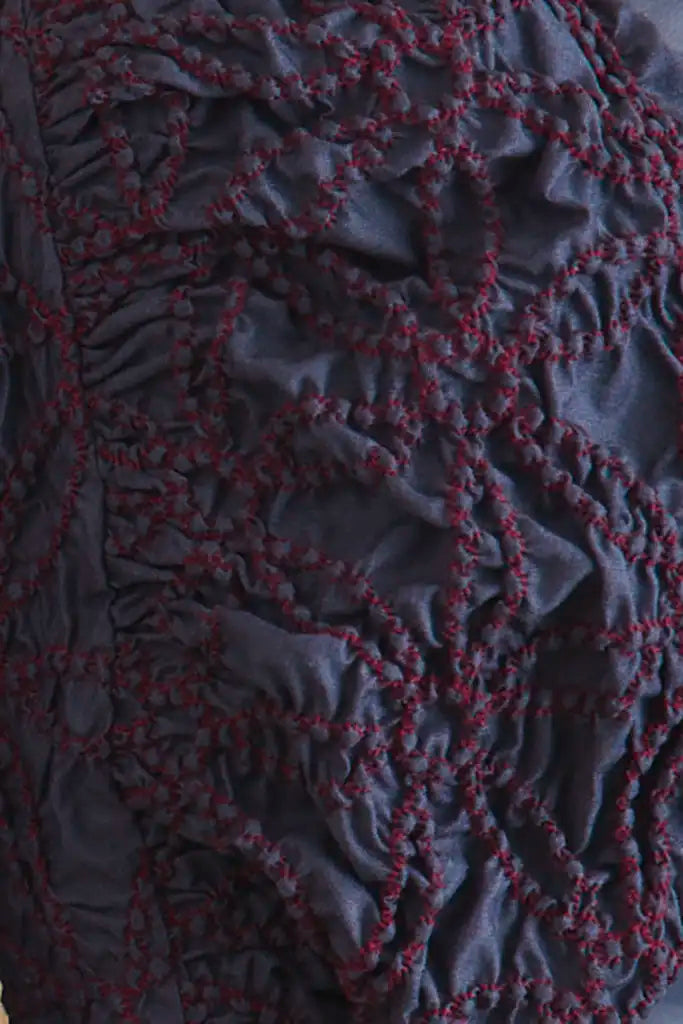 The Blythe Dress is midi body con dress with a crew neckline and oversized ruched long sleeves.