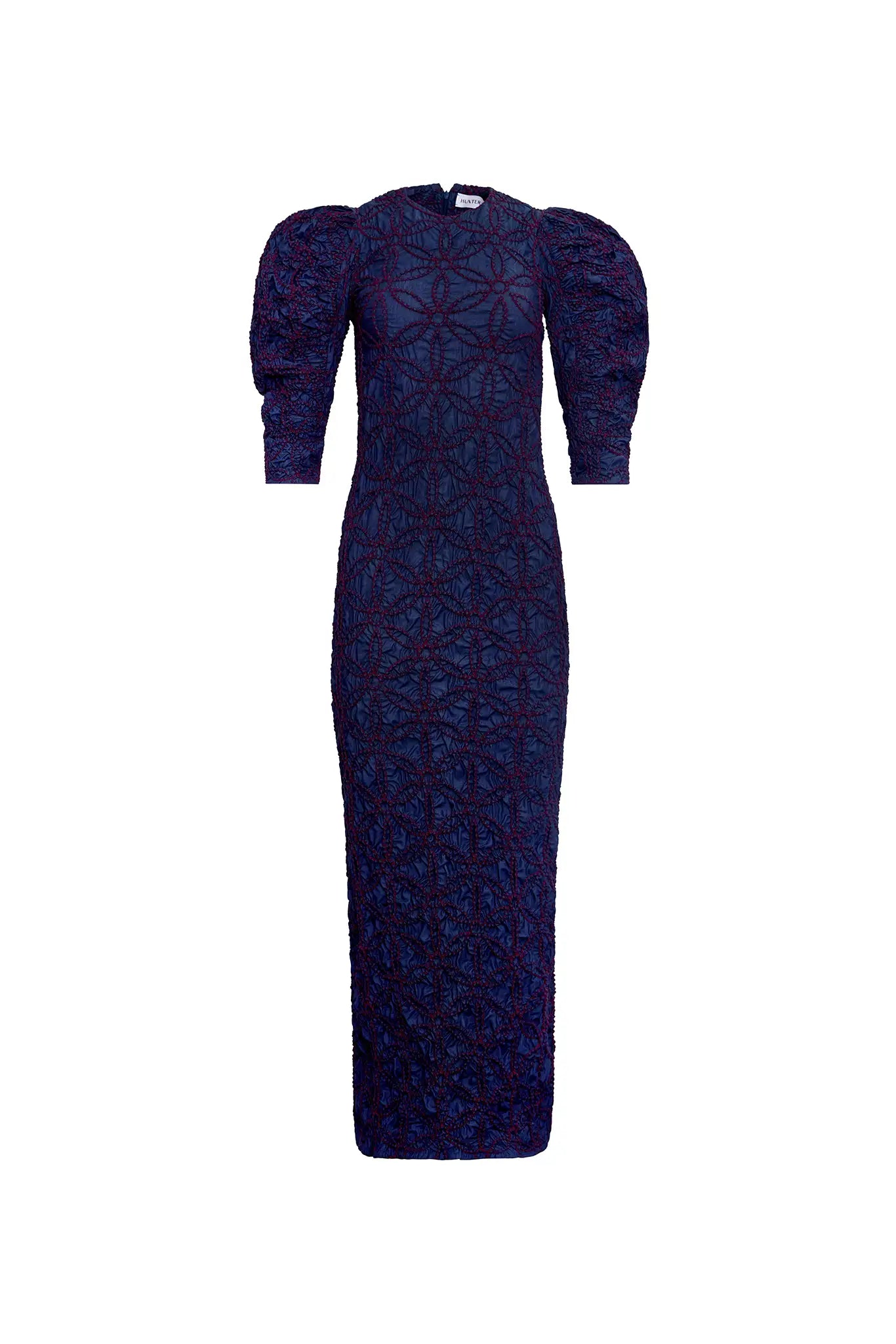 The Blythe Dress is midi body con dress with a crew neckline and oversized ruched long sleeves.