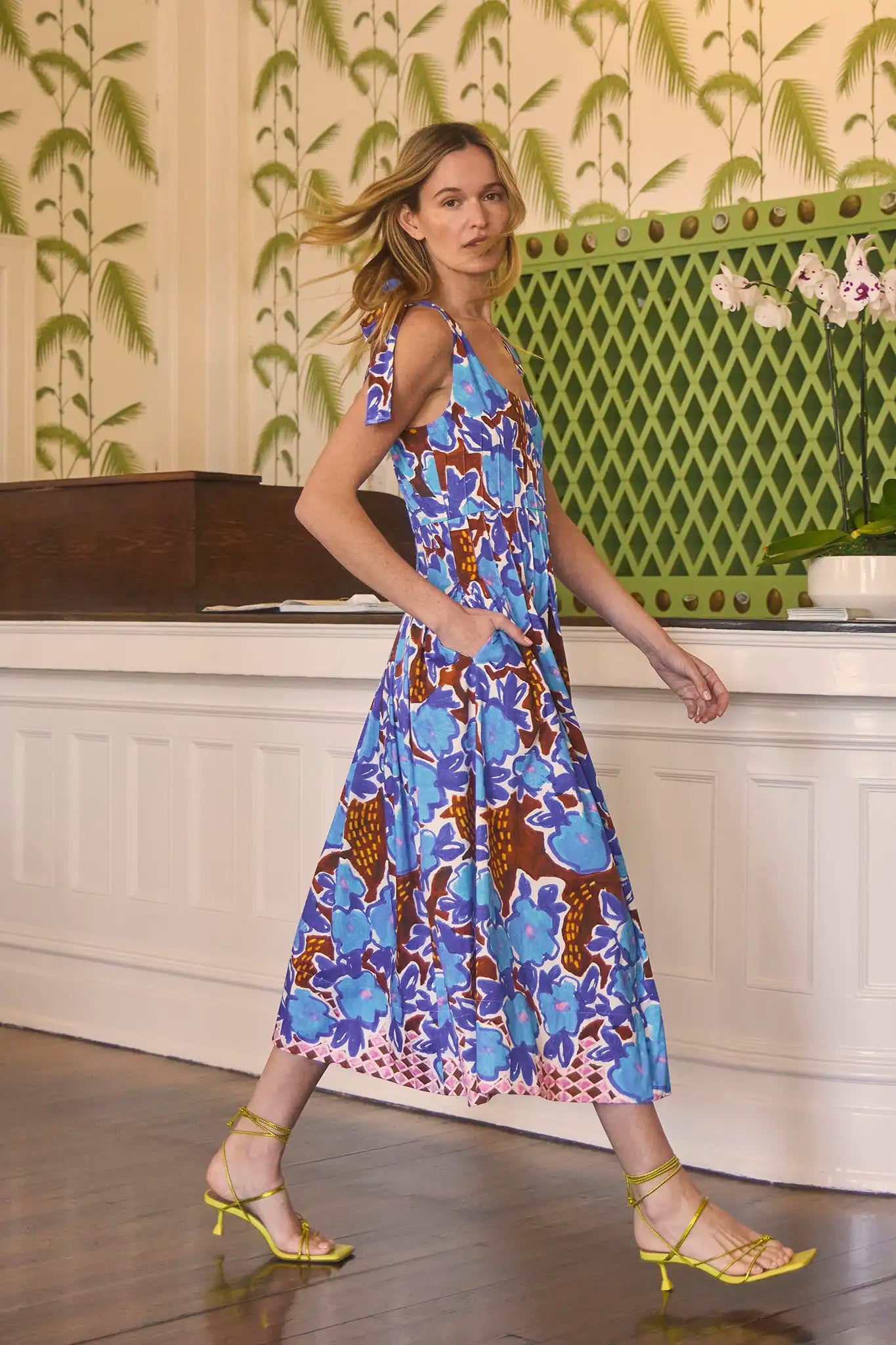 The Braden Dress has a scoop neck, fitted bodice, waistline pintucks, self-ties at the shoulders.