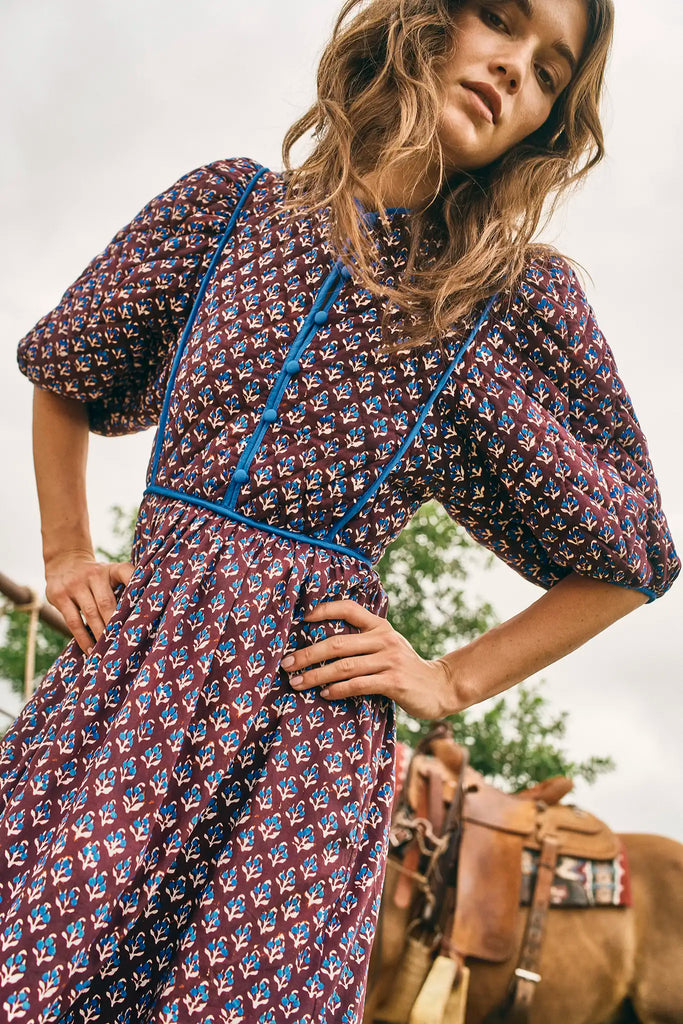 The Brenner Dress has a button-front placket with mini quilting and reverse contrast trim.