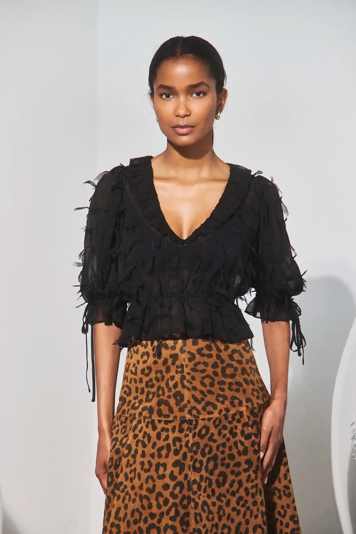 The Bridges Top in Manhattan Chiffon Onyx paired with the Ida Skirt in Soho Leopard Camel.