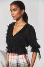 The Bridges Top in Manhattan Chiffon Onyx paired with the Ridley Pant in Kensington Plaid Crimson. 