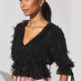 The Bridges Top in Manhattan Chiffon Onyx paired with the Ridley Pant in Kensington Plaid Crimson. 