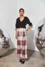The Bridges Top in Manhattan Chiffon Onyx paired with the Ridley Pant in Kensington Plaid Crimson. 