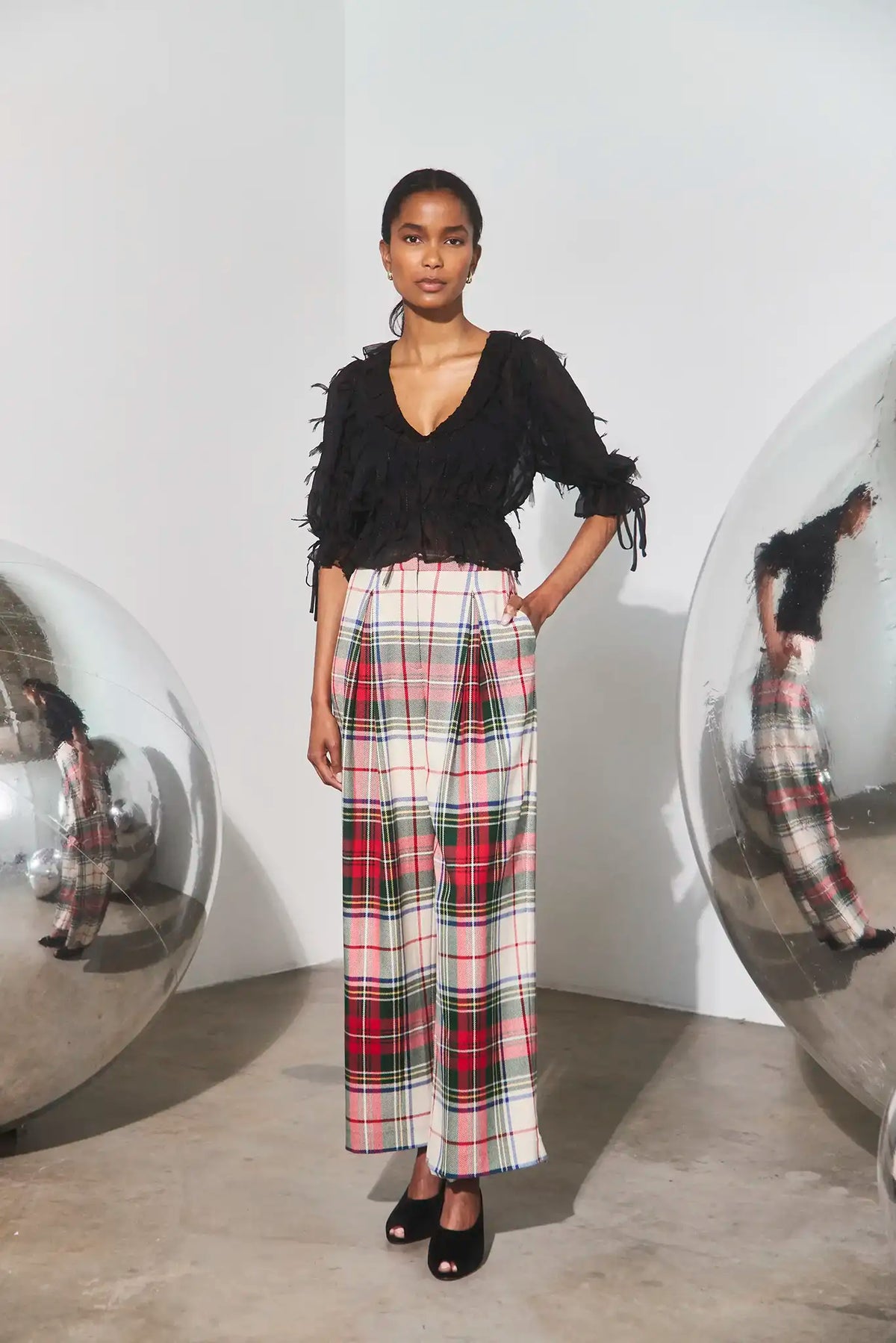 The Bridges Top in Manhattan Chiffon Onyx paired with the Ridley Pant in Kensington Plaid Crimson. 