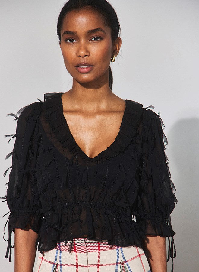 The Bridges Top in Manhattan Chiffon Onyx paired with the Ridley Pant in Kensington Plaid Crimson. 