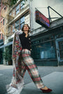 The Ridley Pant in Kensington Plaid Crimson paired with the Brooke Cardigan in Noir.
