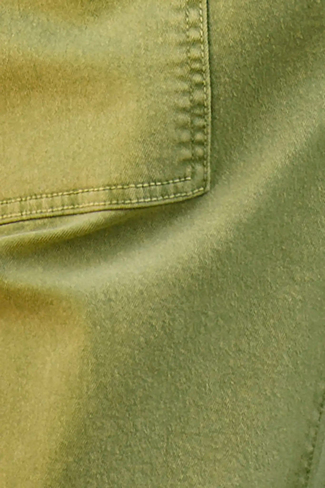Close up of the Mallory Jean in leaf green denim.