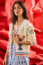The Callen Cardigan in Lobster Multi paired with bathing suit in coastal conversation and bay skirt.