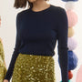 The Callie Sweater in Midnight Blue paired with Lindsey Skirt in Moss Sequin. 