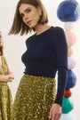 The Callie Sweater in Midnight Blue paired with Lindsey Skirt in Moss Sequin. 