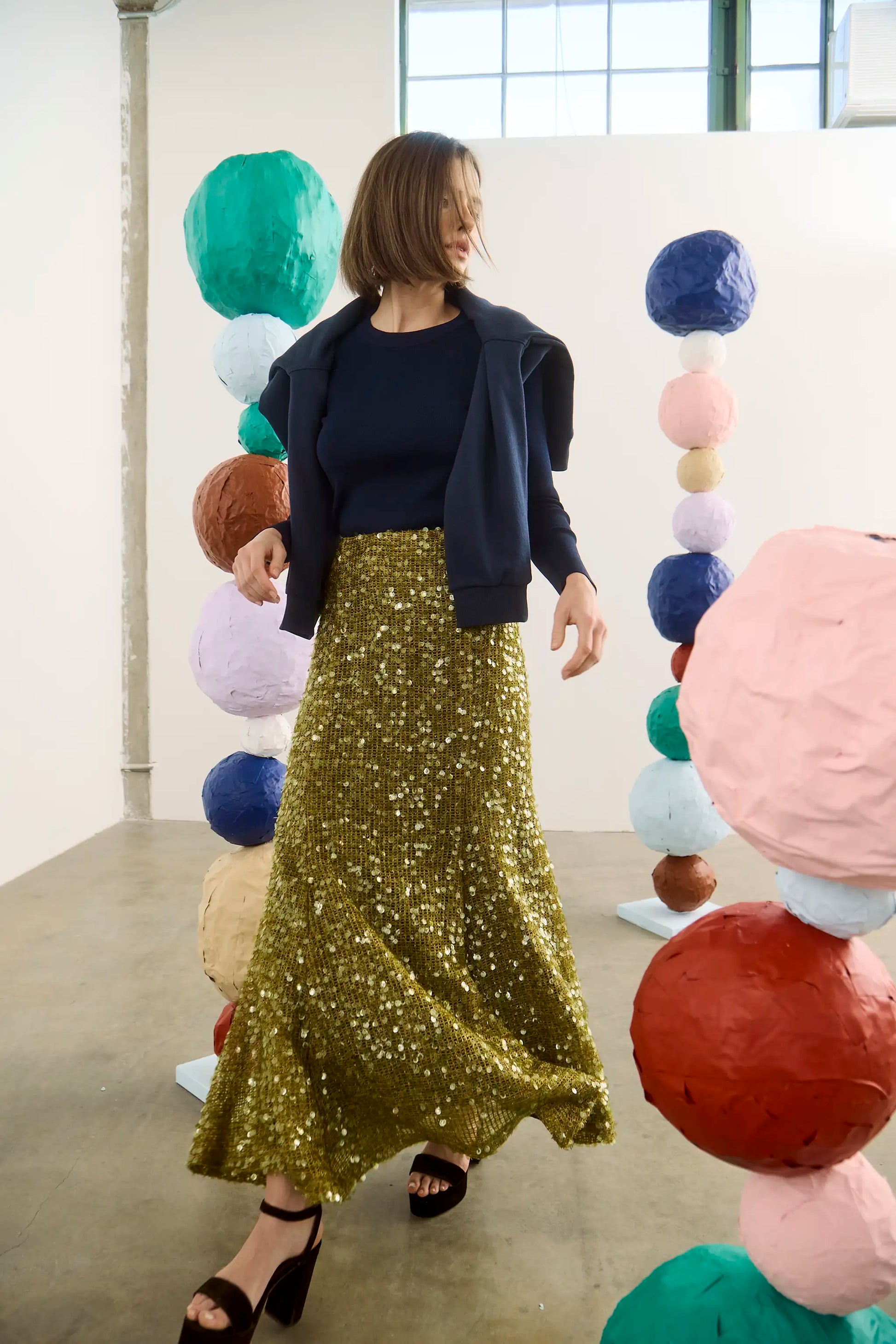 The Callie Sweater in Midnight Blue paired with Lindsey Skirt in Moss Sequin. 