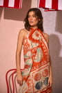 The Sarong Cover Up in Lost at Sea print tied as a halter dress.