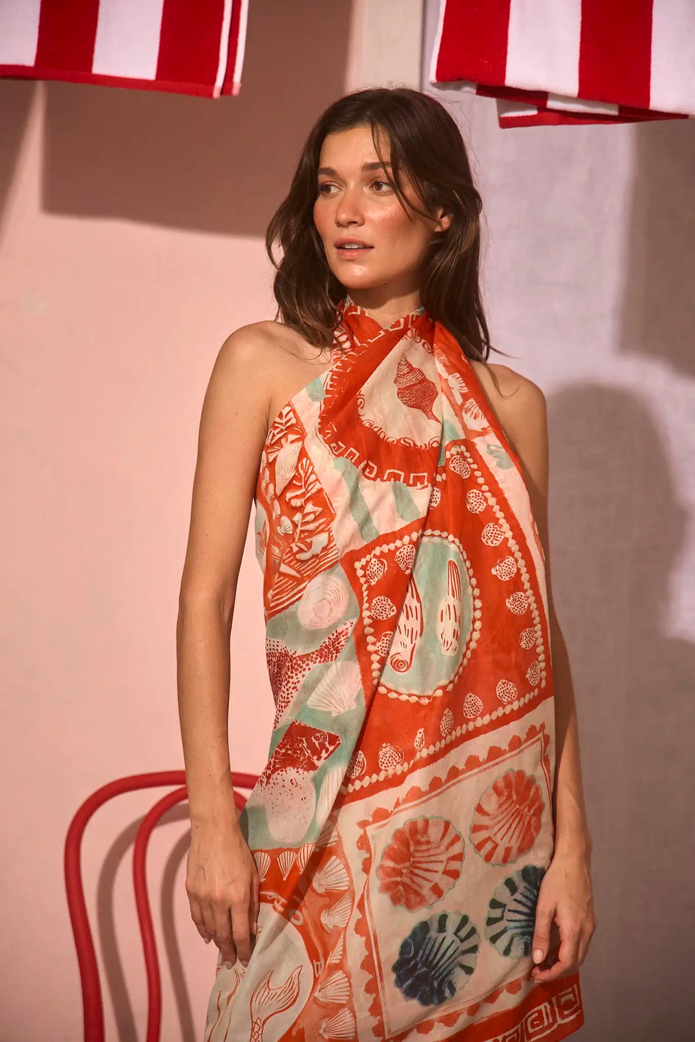 The Sarong Cover Up in Lost at Sea print tied as a halter dress.