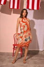 The Sarong Cover Up in Lost at Sea print tied as a halter dress.