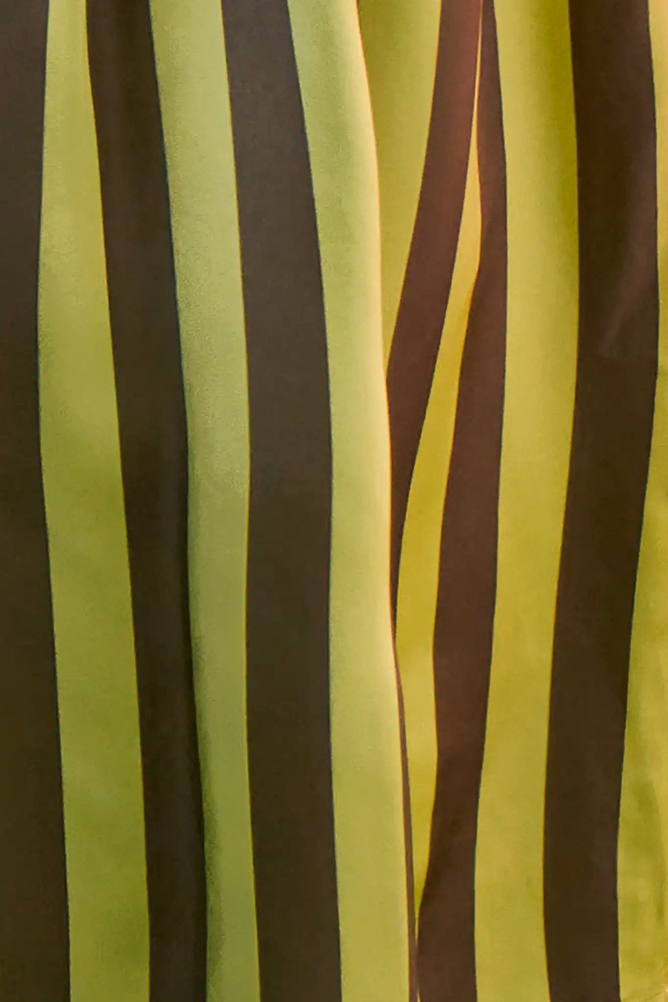 Close up of the Cyprus Pant, dark green & yellow striped pants.