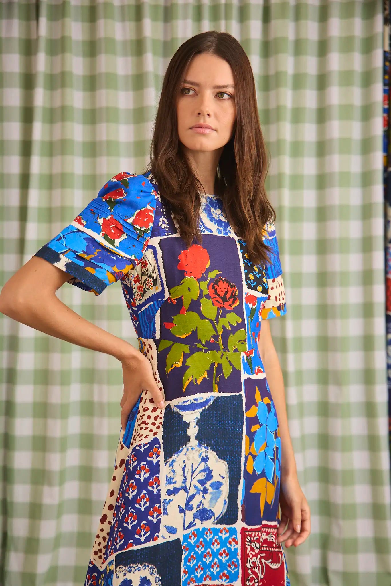 The Casey Dress is a sheath midi with a curved waist seam, relaxed skirt and pleated short sleeves.