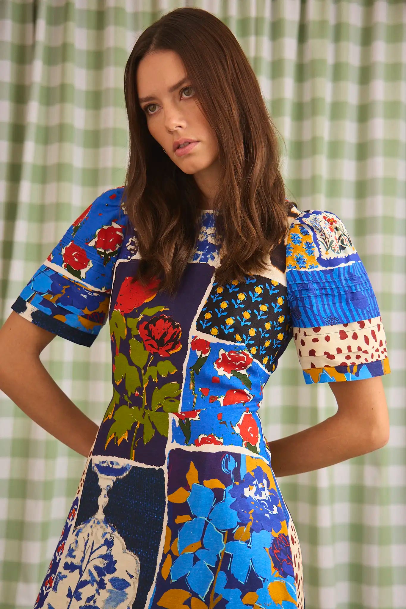 The Casey Dress is a sheath midi with a curved waist seam, relaxed skirt and pleated short sleeves.