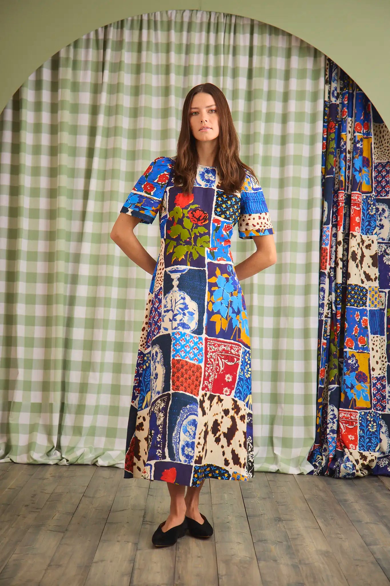 The Casey Dress is a sheath midi with a curved waist seam, relaxed skirt and pleated short sleeves.