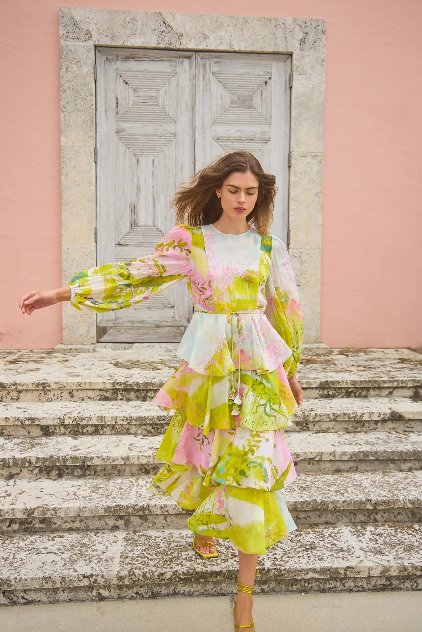 The Chelsea Dress is a multi-tiered maxi with a crew neckline and long sleeves with elastic cuffs.