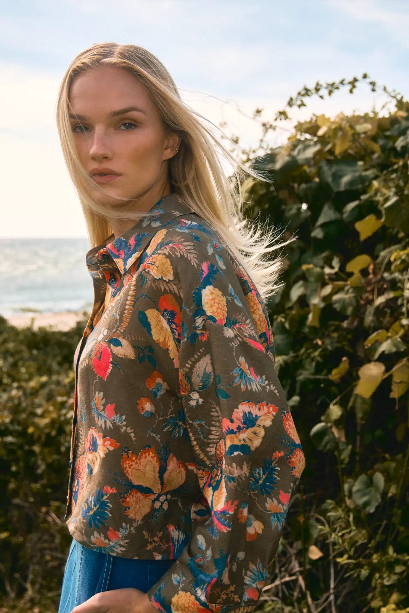 Olive Floral print, boxy collared shirt with button front and wide cropped sleeves, and oversized.