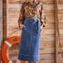 Denim midi skirt framed by patch pockets with crisp topstitching and a removable belt with a D-ring.