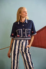The Clay Top in Deep Sea paired with Juno Paint in Lighthouse Navy Stripe.