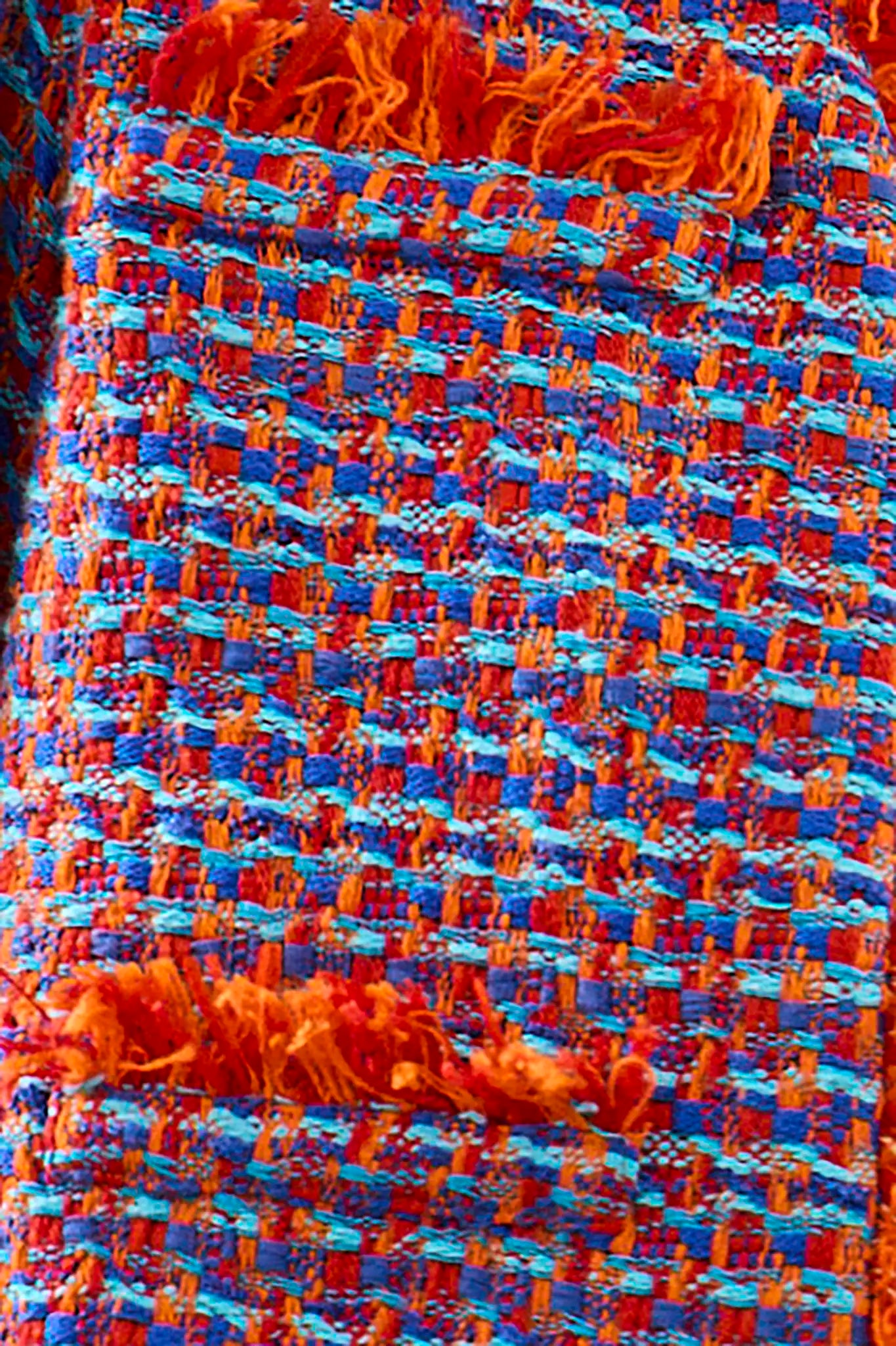 The Coco Jacket is a cropped jacket made with French lurex tweed and finished with Italian cording.