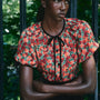The Connelly Top in Crimson Blossom paired with the Atlyn Skirt in Velvet Onyx. 
