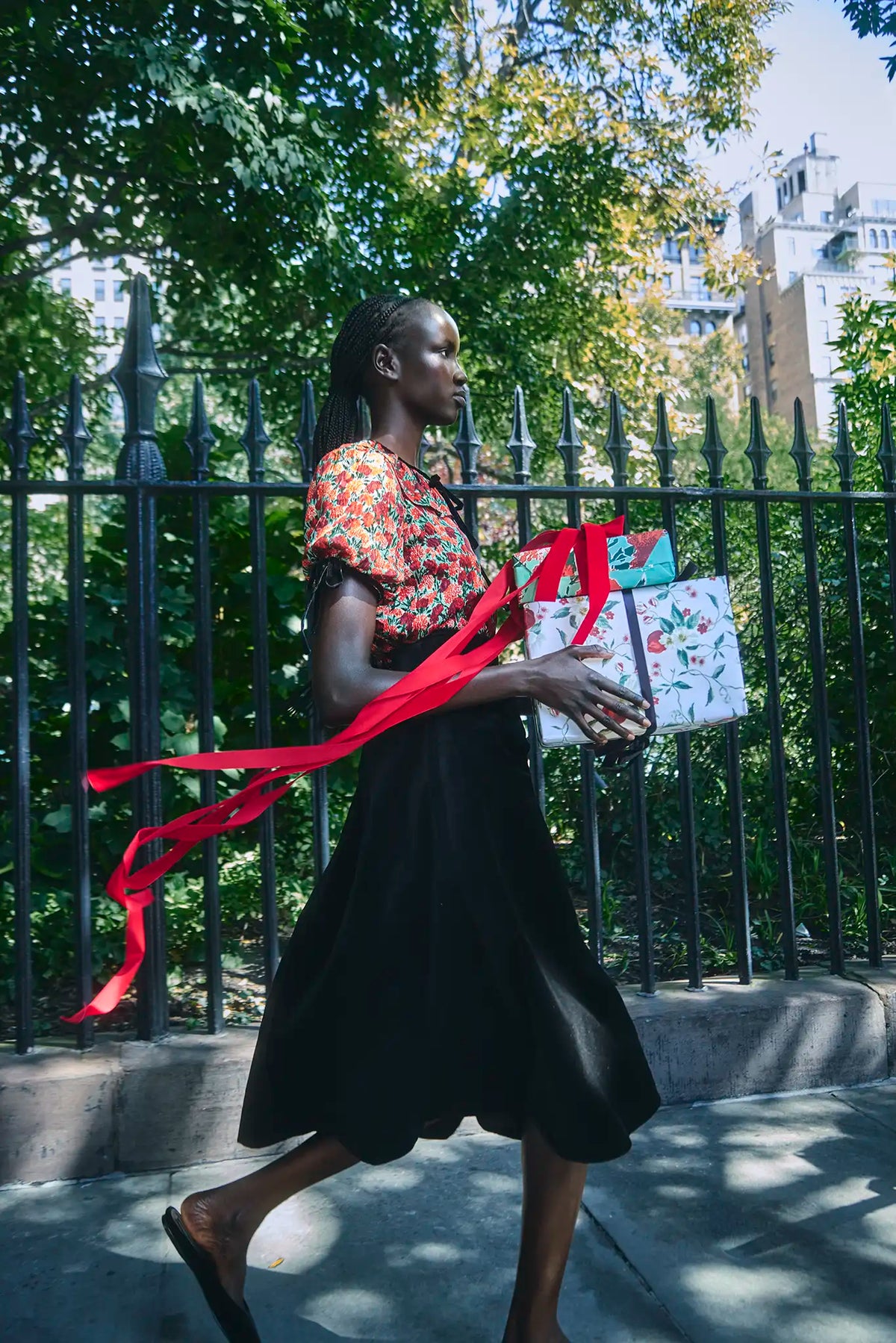 The Connelly Top in Crimson Blossom paired with the Atlyn Skirt in Velvet Onyx. 