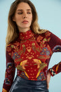 The Connor Top in Birds of a Feather Maroon paired with the Meeghan Mini Skirt in Navy. 