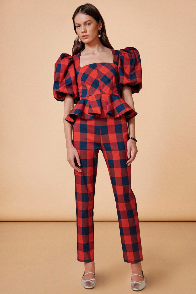 The Carson plaid pants feature a banded waist, straight cut and cropped profile.