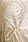 The Cosette Dress in Battenberg Cotton Lace has a relaxed silhouette and drawcord waist