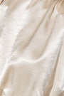 Close up of the Cosima Top in Champagne on Fifth.
