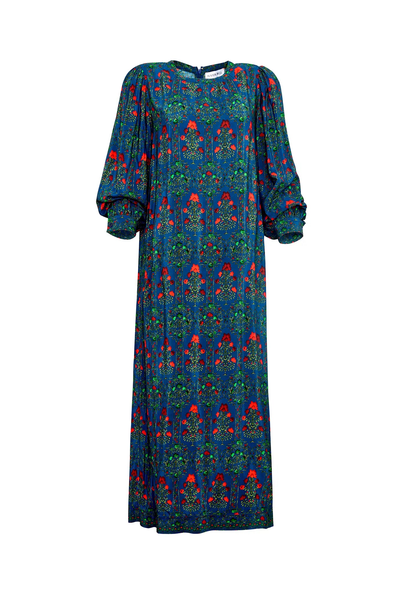 The Crosby Dress has a shirred round neckline, long sleeves, banded cuffs, and straight, silhouette.