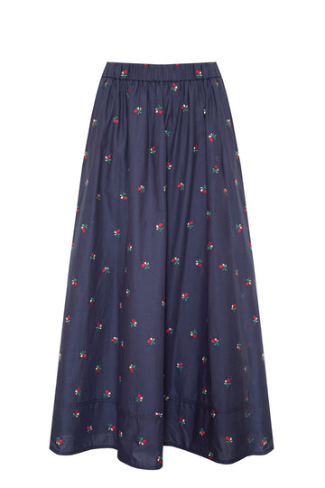 The Tatum midi skirt has a covered elastic waist, a relaxed fit, and an embroidered floral print.