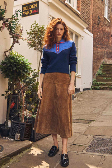 The Ida skirt is 100% real suede, fitted at the waist, relaxed through the hip, with a full skirt.