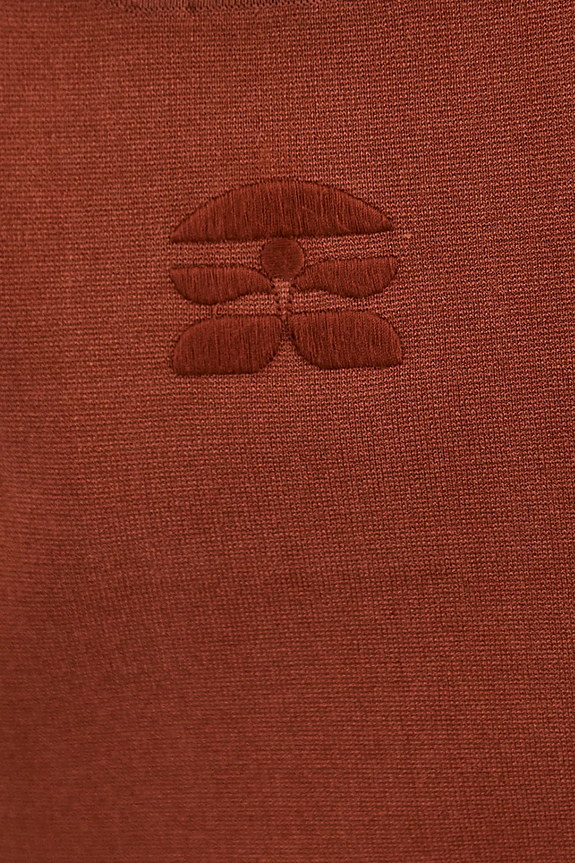 Close up of the back of the Davis Cami with the subtle HB logo. 