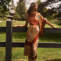 The Allyne Skirt in Amber Glen Brown paired with Davis Cami in Rust and matching scarf. 